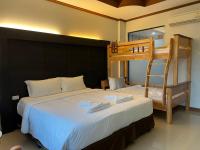 Blue Carina Hotel Phuketにあるベッド