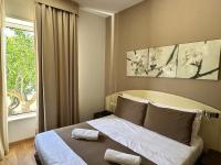 Łóżko lub łóżka w pokoju w obiekcie Hotel La Pergola