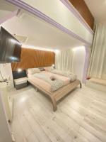 A bed or beds in a room at Yes, yes! lovely apartment good amenities Budapest center