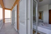 Postel nebo postele na pokoji v ubytování Apartments Grozdana