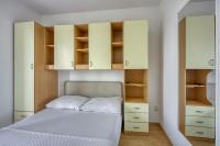 Postel nebo postele na pokoji v ubytování Apartments Grozdana