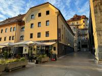 an empty street in a city with buildings at Hotel Lent in Maribor