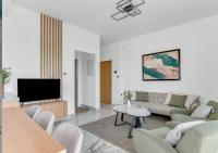 TV a/nebo společenská místnost v ubytování Olive Shared Pool Apartments
