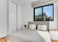 Postel nebo postele na pokoji v ubytování Olive Shared Pool Apartments