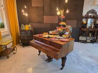 a table with food on top of a piano at B & B Drava in Koprivnica