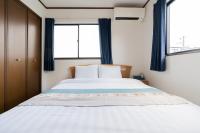 Giường trong phòng chung tại 福屋 天下茶屋站