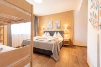 Posteľ alebo postele v izbe v ubytovaní Naturpark Chalets Lambrecht by ALPS RESORTS