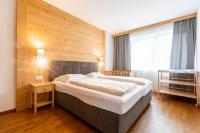 Posteľ alebo postele v izbe v ubytovaní Naturpark Chalets Lambrecht by ALPS RESORTS