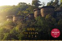a poster for the mitzlin programme with trees at Keemala in Kamala Beach