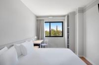Postel nebo postele na pokoji v ubytování B&B HOTEL Zaragoza Centro