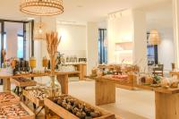a store with tables filled with different types of food at Hotel & Spa Blau Parc in San Antonio