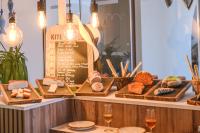a display of different types of breads and wine glasses at Hotel & Spa Blau Parc in San Antonio