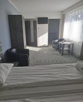 Łóżko lub łóżka w pokoju w obiekcie Hotel Giżycko