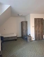Łóżko lub łóżka w pokoju w obiekcie Hotel Giżycko