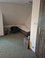 Łóżko lub łóżka w pokoju w obiekcie Hotel Giżycko