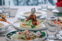 a table with plates of food on top of it at Lamori Resort & Spa in Thanh Hóa