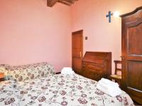A bed or beds in a room at Rustic Holiday Home in Città di Castello with Swimming Pool
