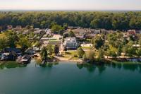 an aerial view of a resort on a lake at Fontane Hotel in Schorfheide
