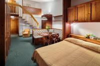 Posteľ alebo postele v izbe v ubytovaní Hotel Cristallino d'Ampezzo