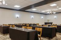 a conference room with tables and chairs in it at Hotel Preston Nashville Airport in Nashville