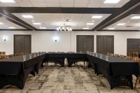 a large conference room with a long table with wine glasses at Hotel Preston Nashville Airport in Nashville
