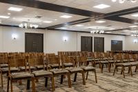 a room with rows of chairs in a hall at Hotel Preston Nashville Airport in Nashville