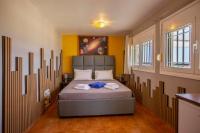 A bed or beds in a room at Kallithea Breeze Luxury Villa