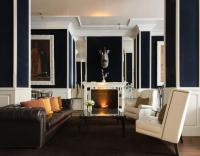 a living room with a couch and a fireplace at Only YOU Boutique Hotel Madrid in Madrid