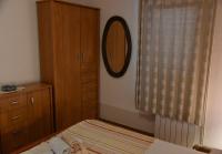 Postel nebo postele na pokoji v ubytování Apartments Ema