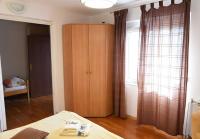 Postel nebo postele na pokoji v ubytování Apartments Ema