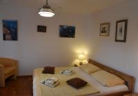 Postel nebo postele na pokoji v ubytování Apartments Ema