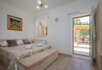 Posteľ alebo postele v izbe v ubytovaní Apartment Dora