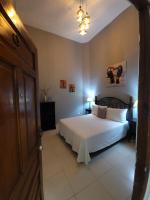 Postel nebo postele na pokoji v ubytování Hotel Class Colonial