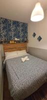A bed or beds in a room at EN EL CORAZON DE GRANADA