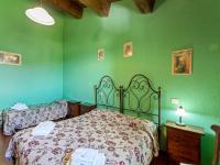 A bed or beds in a room at Rustic Holiday Home in Città di Castello with Swimming Pool