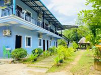 a blue house with a staircase leading up to it at Koh Rong 71 Guesthouse in Koh Rong Island