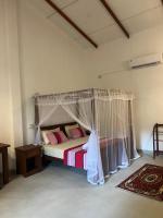 Krevet ili kreveti u jedinici u objektu TEMBO Cottage Wilpattu