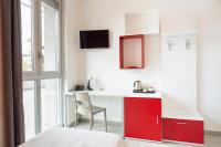 Televízia a/alebo spoločenská miestnosť v ubytovaní Hotel Campus Sanpaolo