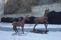 a statue of two giraffes standing next to each other at Le Grand Tétras in Font-Romeu