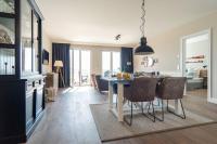 Posezení v ubytování Appartmenthaus-Suedstrand-44-Wohnung-8-Meeresrauschen-am-Suedstrand