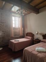 A bed or beds in a room at PICO SACRO II HOTEL Santiago de Compostela