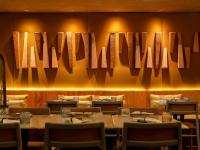 a dining room with tables and chairs and a wall with mirrors at Hotel Gran Marquise in Fortaleza