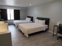 Capri Suites Anaheimにあるベッド