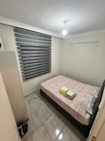 Postel nebo postele na pokoji v ubytování Yalova Cozy Home