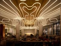 a lobby of a hotel with a large chandelier at The Playford Adelaide - MGallery in Adelaide
