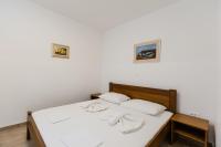 Postel nebo postele na pokoji v ubytování Apartments Lorena