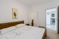 Postel nebo postele na pokoji v ubytování Apartments Lorena