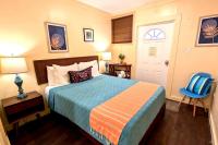 A bed or beds in a room at Waterside Inn