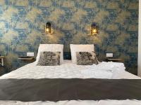 La Maison Blancheにあるベッド