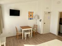 Televízia a/alebo spoločenská miestnosť v ubytovaní Apartment Via